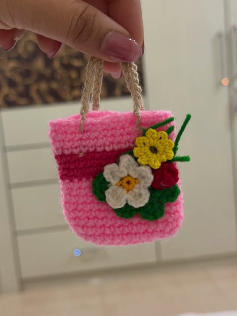 Pink crochet mini bag with flowers by Mona